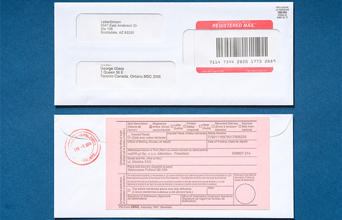 Registered Mail envelope with Registered Mail tracking on one side and the other has the Registered mail pink slip.