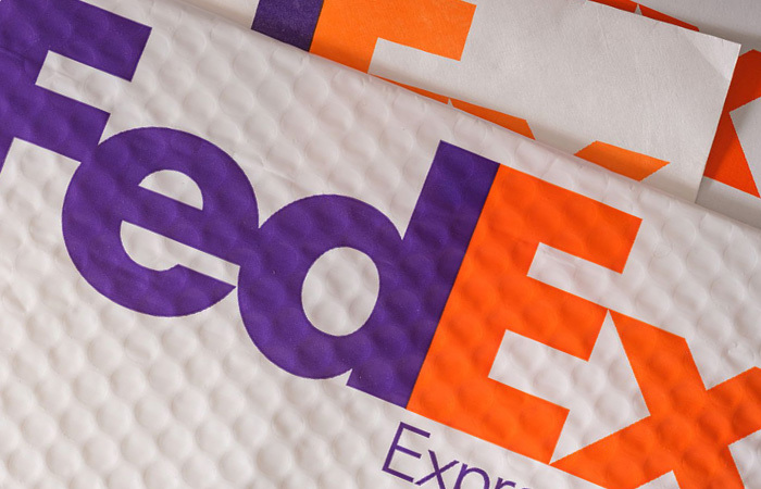 Up close of a FedEx logo on a FedEx envelope
