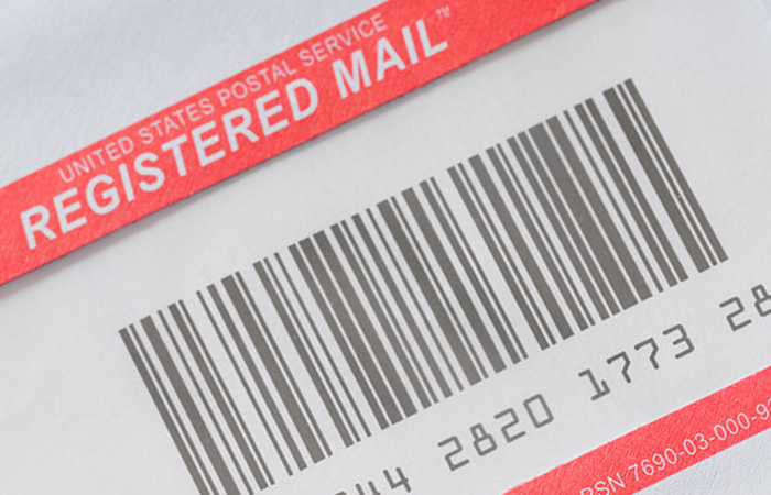 Close up of a Registered Mail barcode with Registered Mail tracking