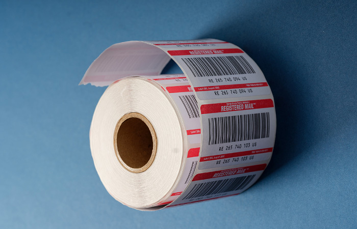 A roll of Registered Mail labels with Registered Mail barcodes