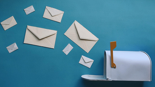 Envelopes flying out of a mailbox