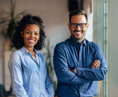 Two smiling people, a man and a women, standing beside each other seemingly pleased they used LetterStream